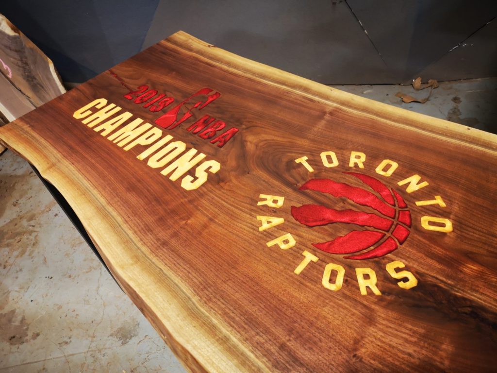 Walnut Coffee Table with Toronto Raptors Logo Anglewood Furniture