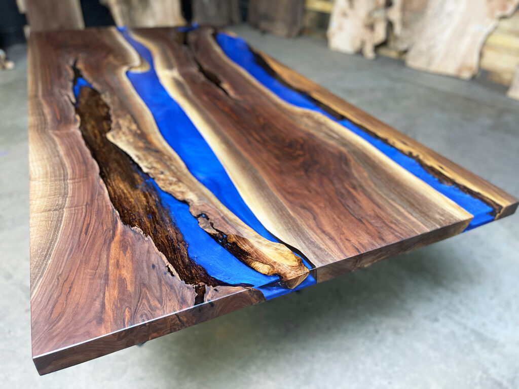 Walnut-river-dining-table-ocean-blue-clear-top-rustic-angle-wood-three-quarters