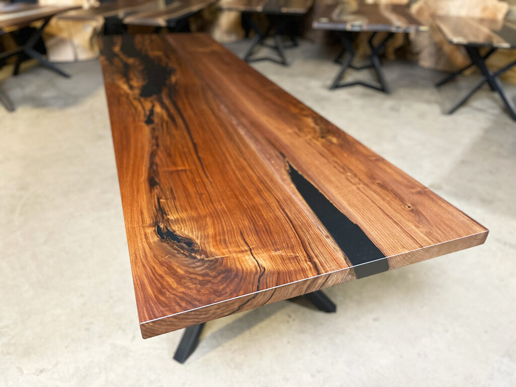 Narrow Walnut Dining Table with Solid Black Epoxy - side view