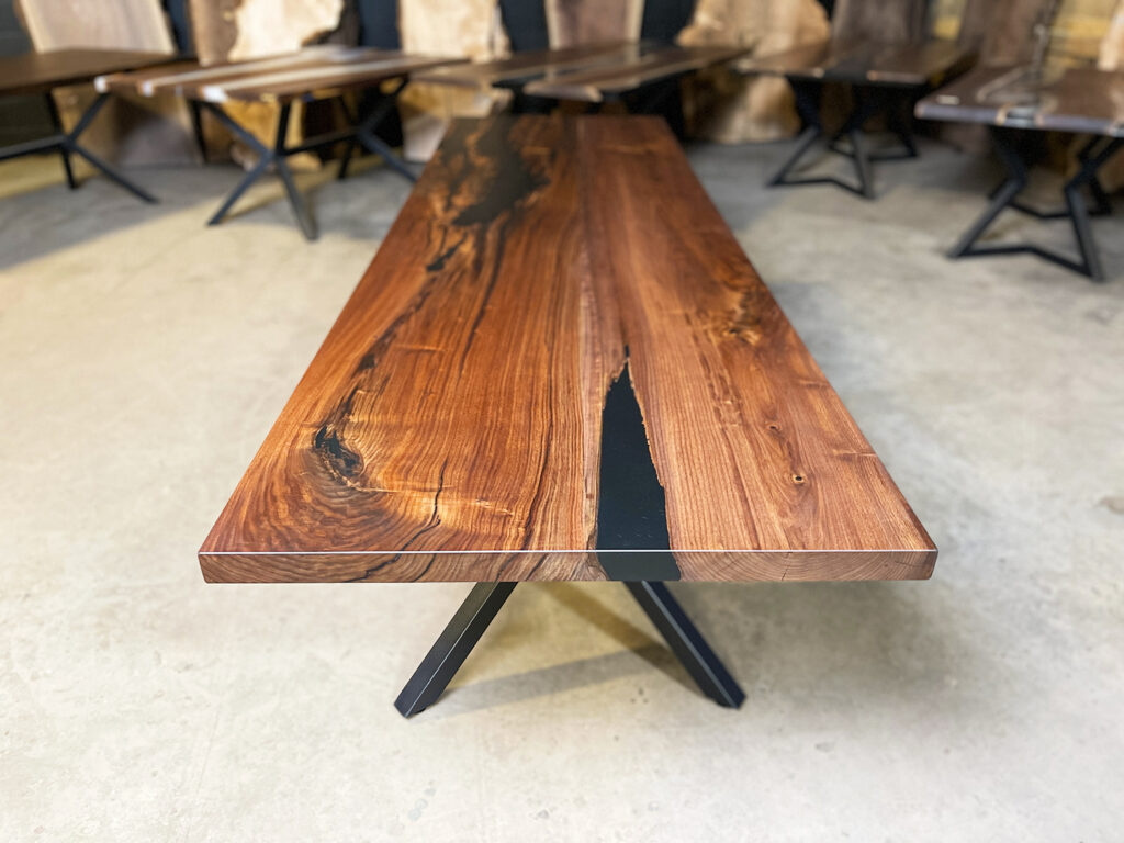 Narrow Walnut Dining Table with Solid Black Epoxy - warm wood and dark epoxy