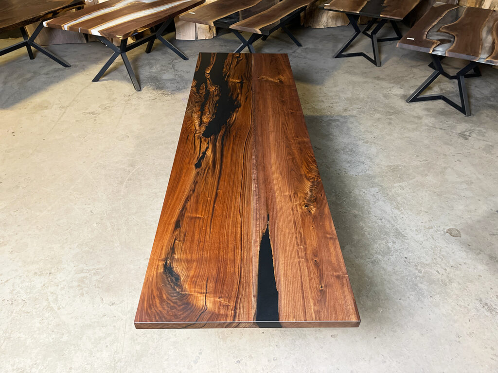 Narrow Walnut Dining Table with Solid Black Epoxy - natural wood lines