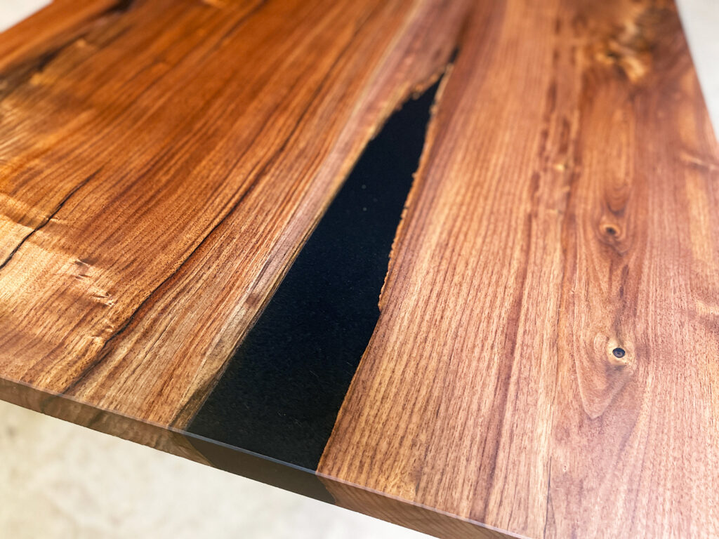 Narrow Walnut Dining Table with Solid Black Epoxy - mesmerizing epoxy
