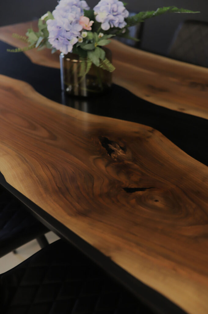 Walnut Table  – Black & Grey Clear Epoxy - epoxy filling into the wood